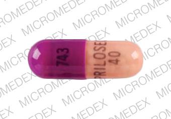 Pill 743 PRILOSEC 40 Pink Capsule/Oblong is Prilosec