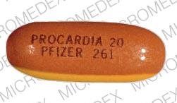 Pill PROCARDIA 20 PFIZER 261 Orange Oval is Procardia