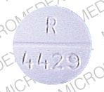 Pill R 4429 White Round is QUINIDINE SULFATE