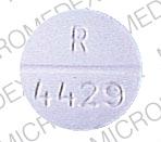 Pill R  4429 White Round is QUINIDINE SULFATE