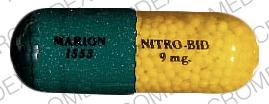 Pill MARION 1553 NITRO-BID 9 mg Green Capsule/Oblong is Nitro-bid