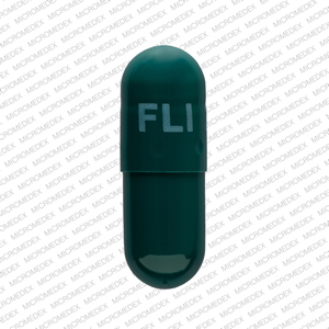 Pill FLI 28 mg Green Capsule-shape is Memantine Hydrochloride Extended Release
