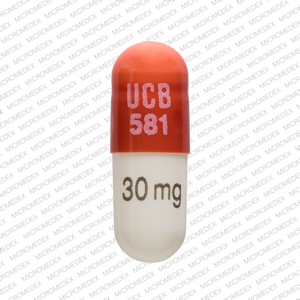 Pill UCB 581 30 mg Brown & White Capsule-shape is Metadate CD