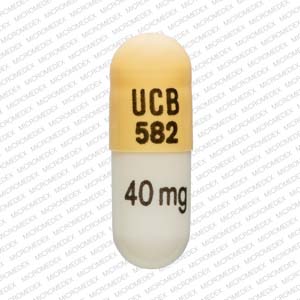 Pill UCB 582 40 mg Yellow & White Capsule/Oblong is Methylphenidate Hydrochloride Extended-Release (CD)