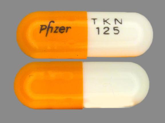 Pill PFIZER TKN 125 Orange Capsule/Oblong is Tikosyn