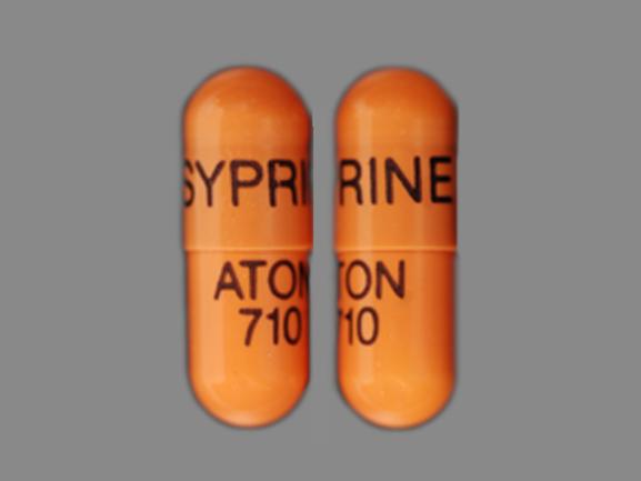 Pill SYPRINE ATON 710 Brown Capsule/Oblong is Syprine