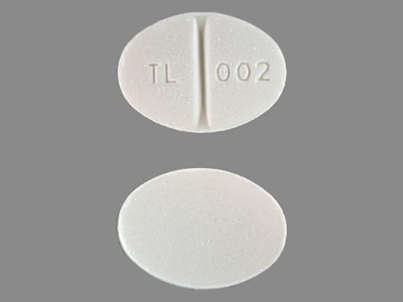 Pill TL 002 White Oval is Methylprednisolone