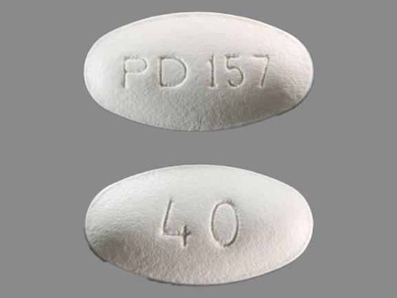 Pill PD 157 40 White Oval is Atorvastatin Calcium