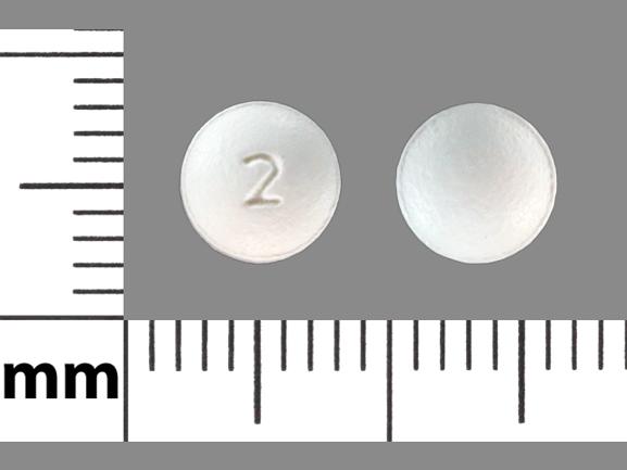 Pill 2 White Round is Atorvastatin Calcium