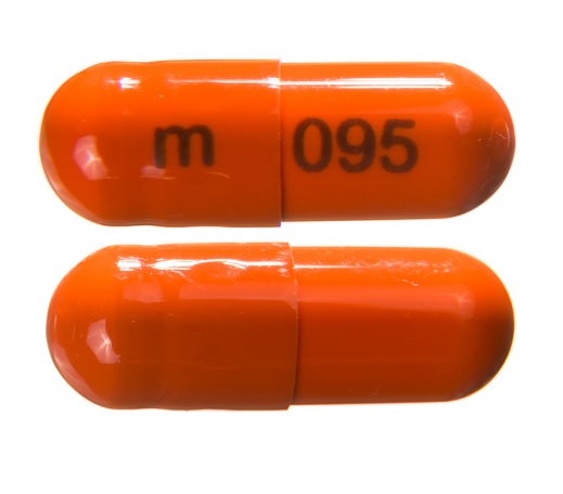 Pill m 095 Orange Capsule/Oblong is Disopyramide Phosphate