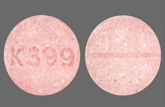 Pill K399 Pink Round is Meclizine Hydrochloride