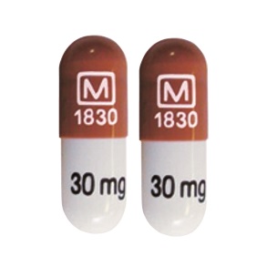 Pill M 1830 30 mg White Capsule/Oblong is Methylphenidate Hydrochloride Extended-Release