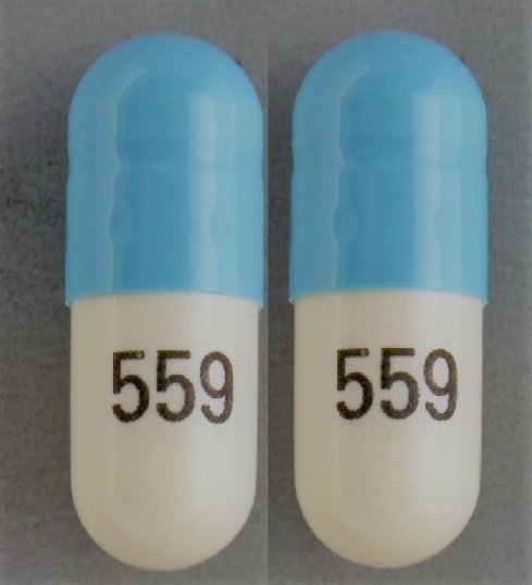 Pill 559 Blue & White Capsule/Oblong is Nitrofurantoin (Macrocrystals)