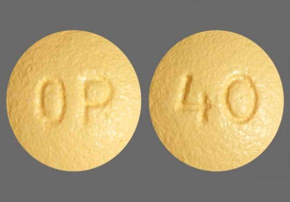 Pill OP 40 Yellow Round is Oxycodone Hydrochloride Extended-Release