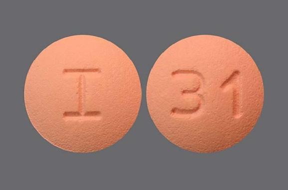 Pill I 31 Pink Round is Rosuvastatin Calcium