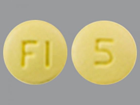 Pill FI 5 Yellow Round is Rosuvastatin Calcium