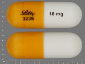 Pill LILLY 3238 18 mg Gold & White Capsule/Oblong is Strattera