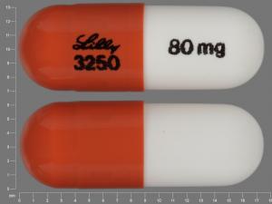 Pill LILLY 3250 80 mg Brown & White Capsule/Oblong is Strattera