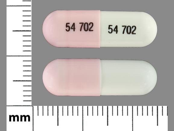 Pill 54 702 54 702 Pink & White Capsule/Oblong is Lithium Carbonate