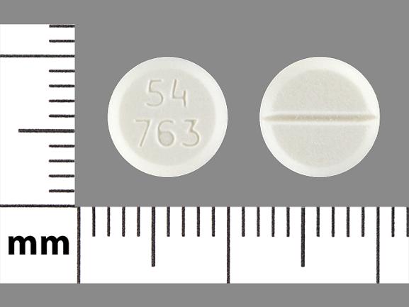 Pill 54 763 White Round is Megestrol Acetate
