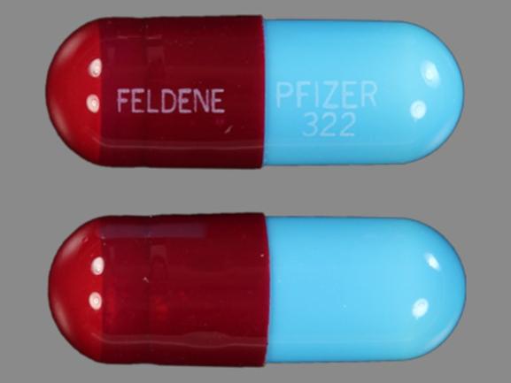 Pill FELDENE PFIZER 322 Red Capsule/Oblong is Feldene