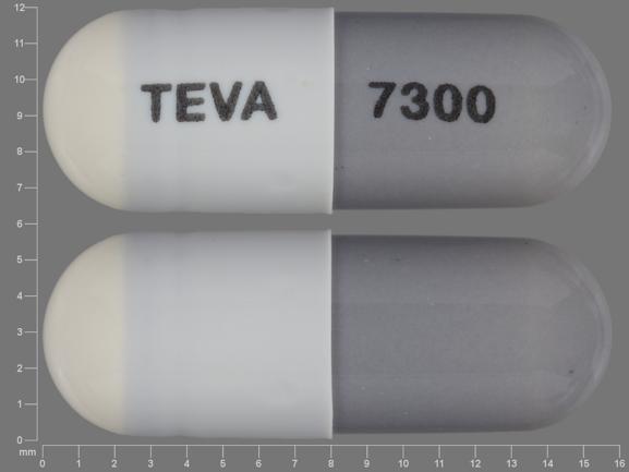 Pill TEVA 7300 Gray & White Capsule/Oblong is Minocycline Hydrochloride