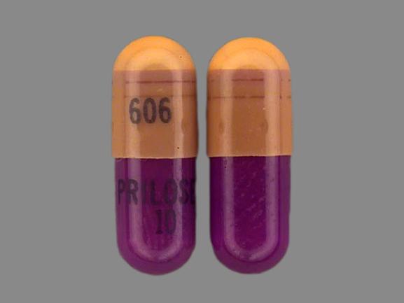 Pill 606 PRILOSEC 10 Pink & Purple Capsule-shape is Prilosec
