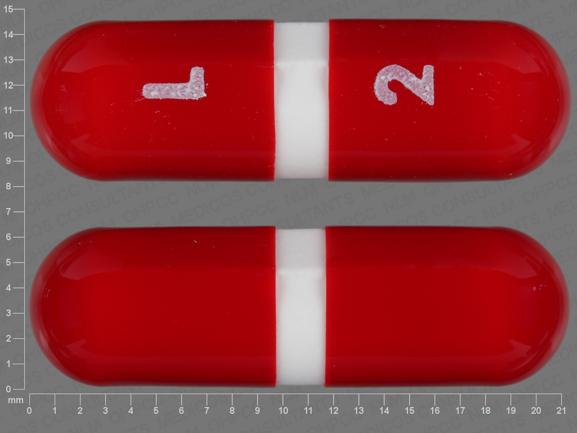 Pill L 2 Red Capsule-shape is Acetaminophen and Caffeine