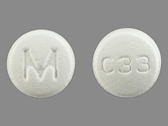 Pill M C33 White Round is Carvedilol