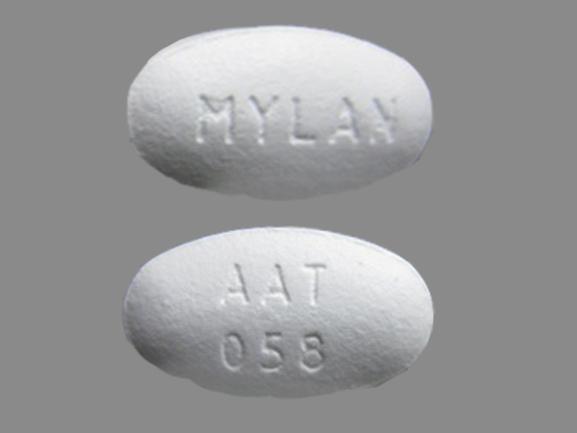 Pill AAT 058 MYLAN White Oval is Amlodipine Besylate and Atorvastatin Calcium