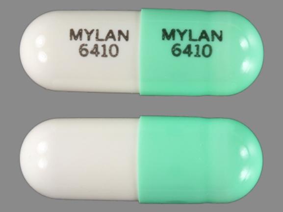 Pill MYLAN 6410 MYLAN 6410 Green & White Capsule/Oblong is Doxepin Hydrochloride