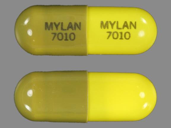 Pill MYLAN 7010 MYLAN 7010 Green & Yellow Capsule/Oblong is Loxapine Succinate