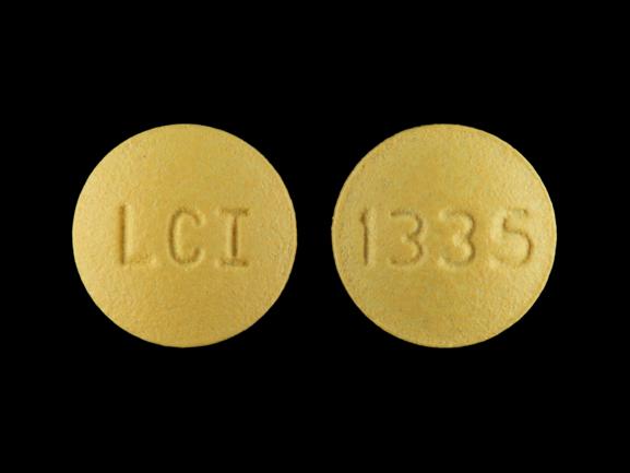 Pill LCI 1335 Yellow Round is Doxycycline Monohydrate