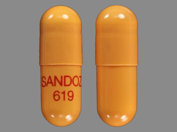 Pill SANDOZ 619 Orange Capsule/Oblong is Rivastigmine Tartrate