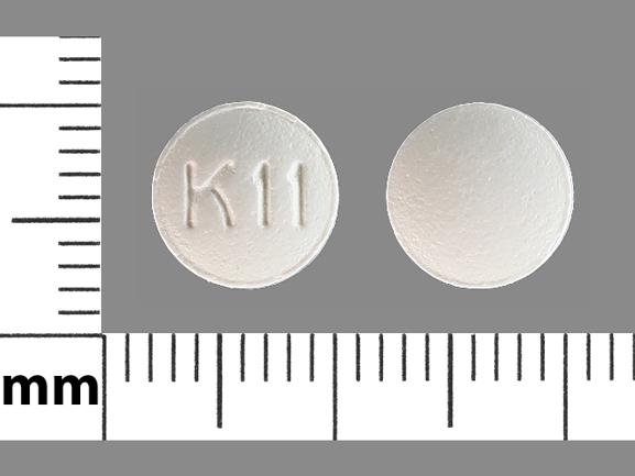 Pill K 11 White Round is Hydroxyzine Hydrochloride