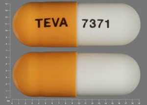 Pill TEVA 7371 Orange & White Capsule-shape is Amlodipine Besylate and Benazepril Hydrochloride