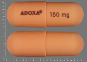 Pill ADOXA 150 mg Orange Capsule/Oblong is Adoxa