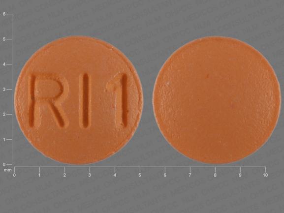 Pill RI1 Orange Round is Risperidone