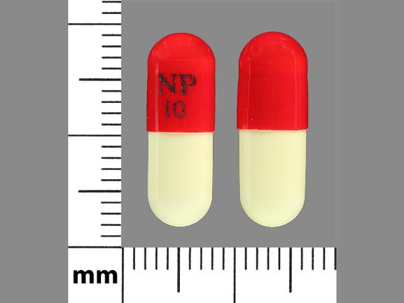 Pill NP 10 Orange & White Capsule/Oblong is Piroxicam