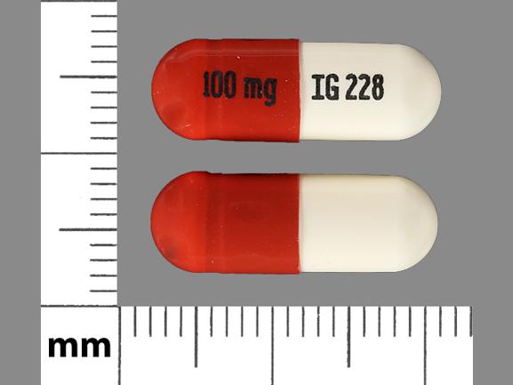 Pill 100 mg IG228 Brown & White Capsule/Oblong is Zonisamide