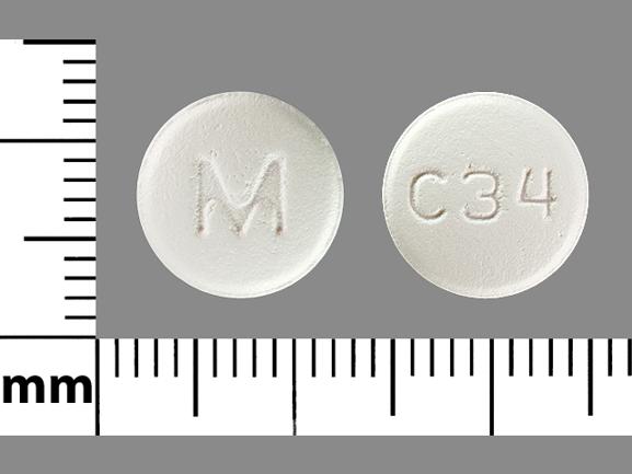 Pill M C34 White Round is Carvedilol