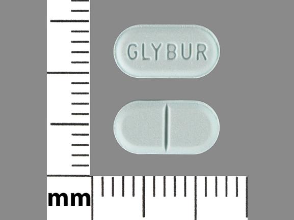 Pill GLYBUR Blue Capsule-shape is Glyburide