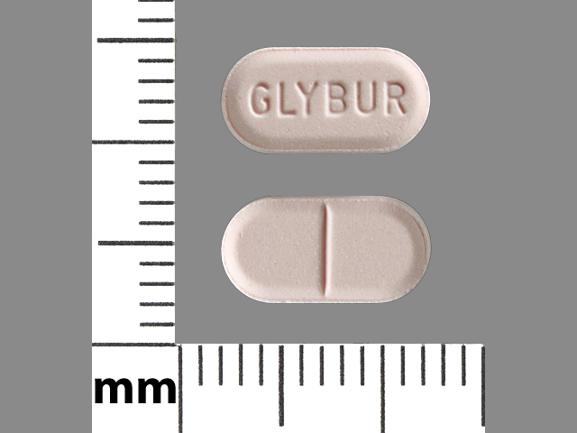Pill GLYBUR Pink Capsule-shape is Glyburide