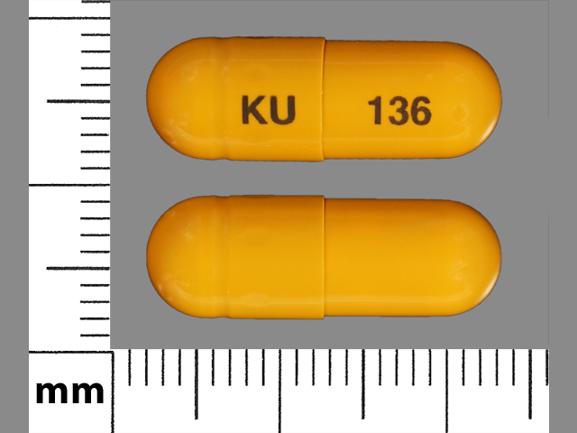 Pill KU 136 Yellow Capsule/Oblong is Omeprazole Delayed Release