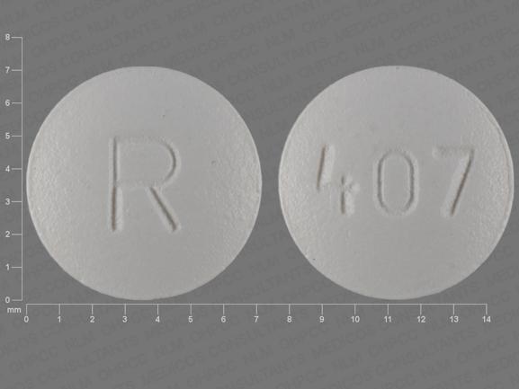 Pill R 407 White Round is Amlodipine Besylate and Atorvastatin Calcium