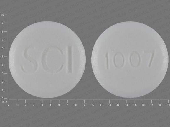 Pill SCI 1007 White Round is Sodium Fluoride (Chewable)
