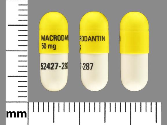 Pill MACRODANTIN 50 mg 52427-287 White & Yellow Capsule/Oblong is Nitrofurantoin (Macrocrystals)