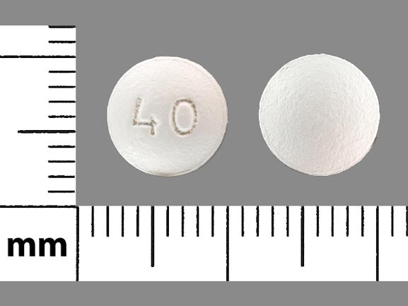 Pill 40 White Round is Atorvastatin Calcium