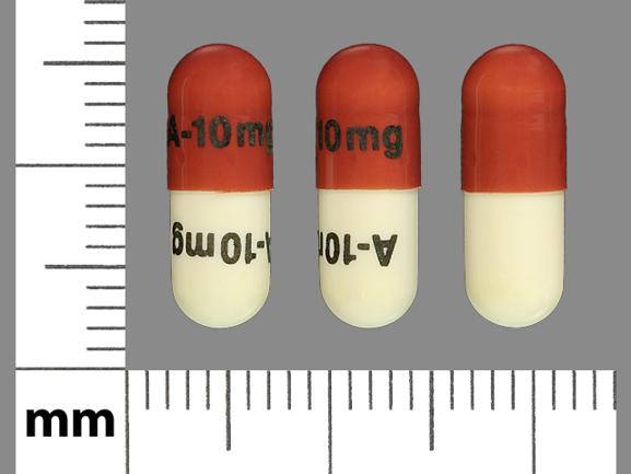 Pill A-10 mg A-10 mg Brown & White Capsule-shape is Acitretin