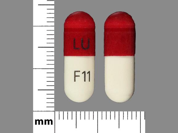 Pill LU F11 Maroon Capsule/Oblong is Cefadroxil Monohydate